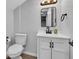 Well-lit bathroom with a sleek vanity, modern fixtures, and a comfortable toilet at 1805 Center Valley Rd, Martinsville, IN 46151