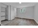 Cozy bedroom with vinyl floors, bright window, and closet space at 1805 Center Valley Rd, Martinsville, IN 46151