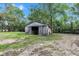 Weathered wooden barn with open doors, surrounded by trees and a spacious yard at 1805 Center Valley Rd, Martinsville, IN 46151