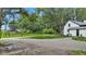 Charming home with a newly graveled parking area, fresh green lawn, and beautiful mature trees at 1805 Center Valley Rd, Martinsville, IN 46151