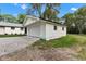 Detached two-car garage featuring a light exterior, black roof, and gravel driveway at 1805 Center Valley Rd, Martinsville, IN 46151