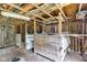 Interior of a wooden barn with exposed beams and aged walls; multiple stall areas at 1805 Center Valley Rd, Martinsville, IN 46151