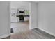 An open kitchen layout with white cabinets, granite countertops, and stainless steel appliances at 1805 Center Valley Rd, Martinsville, IN 46151