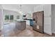 Spacious eat-in kitchen with stainless appliances, white cabinets, center island, and sliding glass doors at 1805 Center Valley Rd, Martinsville, IN 46151