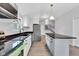 Bright kitchen featuring white cabinets, stainless appliances, a center island, and wood-look floors at 1805 Center Valley Rd, Martinsville, IN 46151