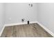 Utility room ready for washer and dryer, with vinyl flooring, and clean, bright space at 1805 Center Valley Rd, Martinsville, IN 46151