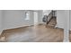 Open-concept living room with vinyl floors leading to a staircase and kitchen at 1805 Center Valley Rd, Martinsville, IN 46151