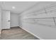 Spacious walk-in closet with wood laminate flooring and shelving for storage at 1805 Center Valley Rd, Martinsville, IN 46151
