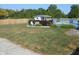 Backyard with partially-brown grass, shed, deck, and wooden privacy fence at 2020 N Hickory Blvd, Greenfield, IN 46140