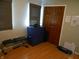 Bedroom with a window, wood floor, closet, and exercise equipment at 2020 N Hickory Blvd, Greenfield, IN 46140