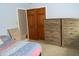 Spacious bedroom with closet, an armchair, and wooden dresser at 2020 N Hickory Blvd, Greenfield, IN 46140