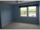 Bright bedroom featuring two windows that provide natural light and a ceiling fan at 2020 N Hickory Blvd, Greenfield, IN 46140