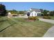 Beautifully landscaped front yard showcasing a charming two-story home with a long driveway at 2020 N Hickory Blvd, Greenfield, IN 46140