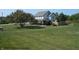 Expansive lawn surrounds this two-story home with an inviting porch and fenced backyard at 2020 N Hickory Blvd, Greenfield, IN 46140