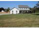 Charming two-story home with a well-manicured front yard and inviting covered porch at 2020 N Hickory Blvd, Greenfield, IN 46140