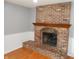 Living room showcasing a classic brick fireplace with wooden mantel at 2020 N Hickory Blvd, Greenfield, IN 46140
