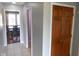 Neutral hallway with tiled floors leading to a dining room with hardwood floors at 2020 N Hickory Blvd, Greenfield, IN 46140