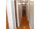Hallway with hardwood floors and neutral paint offering access to other rooms in the home at 2020 N Hickory Blvd, Greenfield, IN 46140