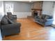 Cozy living room with hardwood floors, a brick fireplace, and comfortable seating at 2020 N Hickory Blvd, Greenfield, IN 46140