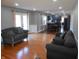 Spacious living room with hardwood flooring, neutral tones, and an open layout at 2020 N Hickory Blvd, Greenfield, IN 46140