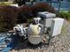 An in-ground swimming pool pump, filter and electrical connections sit on a gravel pad at 2020 N Hickory Blvd, Greenfield, IN 46140