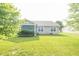 Spacious backyard featuring a well-maintained lawn and a view of the house at 2402 Foxtail Dr, Plainfield, IN 46168