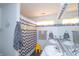 Well-lit bathroom with double sinks, modern fixtures, and playful yellow and gray decor accents at 2402 Foxtail Dr, Plainfield, IN 46168