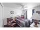 Cozy bedroom with a comfortable bed, accent chair, and soft lighting at 2402 Foxtail Dr, Plainfield, IN 46168