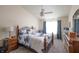 Cozy bedroom with a large bed, vaulted ceiling, carpet flooring and natural light from the window at 2402 Foxtail Dr, Plainfield, IN 46168