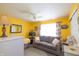 Bright living room with a comfortable sofa, stylish decor, and a large window at 2402 Foxtail Dr, Plainfield, IN 46168