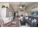 Open-concept living room with ample seating, modern decor, and plenty of natural light, great for entertaining at 2402 Foxtail Dr, Plainfield, IN 46168