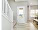 Bright foyer with natural light, showcasing staircase and front door view at 278 Evening Bay Ct, Pendleton, IN 46064
