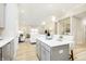 Gourmet kitchen with island seating, stainless appliances, and open layout to the living area at 278 Evening Bay Ct, Pendleton, IN 46064