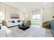 Bright living room features a vaulted ceiling, neutral walls, and large sliding glass door to backyard at 278 Evening Bay Ct, Pendleton, IN 46064