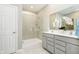 Bright bathroom features a glass-enclosed shower, double vanity, and contemporary finishes at 278 Evening Bay Ct, Pendleton, IN 46064
