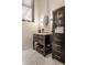 Bathroom with a marble vanity, a dark wood cabinet, and modern mosaic floors at 3959 Central Ave, Indianapolis, IN 46205
