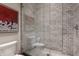 Modern bathroom with a glass-enclosed shower, mosaic tile floor, and stylish fixture at 3959 Central Ave, Indianapolis, IN 46205