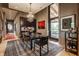 Stylish dining room featuring a modern chandelier and access to an outdoor area at 3959 Central Ave, Indianapolis, IN 46205