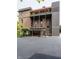 Building exterior showcasing a gray addition, brick structure, and inviting balconies and pergola at 3959 Central Ave, Indianapolis, IN 46205