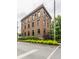 Brick building with decorative stone accents and trimmed hedges viewed from a street corner at 3959 Central Ave, Indianapolis, IN 46205