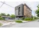 Brick building with modern addition featuring a fenced lot and residential street at 3959 Central Ave, Indianapolis, IN 46205