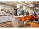 Well-lit kitchen featuring butcher block island, seating, and bright cabinets in finished basement at 3959 Central Ave, Indianapolis, IN 46205
