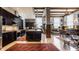 Open concept floorplan displaying the kitchen with a large island and seamless transition to the living area at 3959 Central Ave, Indianapolis, IN 46205