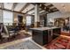 Open-concept layout showcasing the kitchen island with seating and view into the living room at 3959 Central Ave, Indianapolis, IN 46205