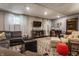Basement living area with modern decor, comfortable seating, and ample natural light at 3959 Central Ave, Indianapolis, IN 46205