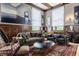 Living room with hardwood floors, paneled walls, decorative trim, stylish sofas and large windows at 3959 Central Ave, Indianapolis, IN 46205