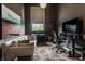 Modern office space with a neutral sofa, large window, and comfortable desk area at 3959 Central Ave, Indianapolis, IN 46205