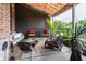 Relaxing patio with comfortable seating, overhead covering, and natural light makes the perfect retreat at 3959 Central Ave, Indianapolis, IN 46205