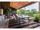 Outdoor patio with covered dining area and a beautiful view of the surrounding greenery at 3959 Central Ave, Indianapolis, IN 46205