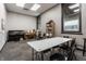 Spacious studio featuring a pair of pianos, wall-to-wall carpeting, and a large table with chairs at 3959 Central Ave, Indianapolis, IN 46205